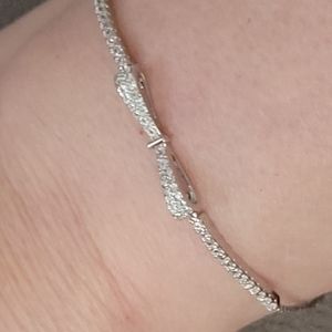 Unmarked metal paired w clear zircons